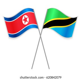 North Korean and Tanzanian crossed flags. North Korea combined with Tanzania isolated on white. Language learning, international business or travel concept.