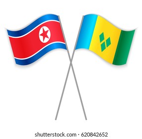 North Korean and Vincentian crossed flags. North Korea combined with Saint Vincent and the Grenadines isolated on white. Language learning, international business or travel concept.