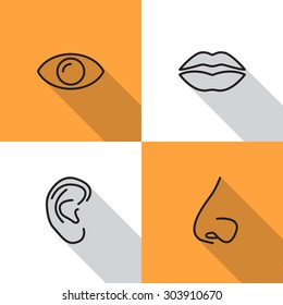 Nose, eye, mouth and ear icon.
