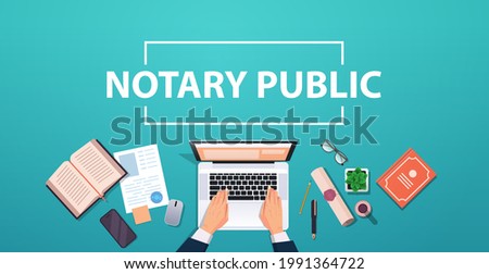 notary hands working on laptop signing and legalization documents lawyer office workplace desk top angle view