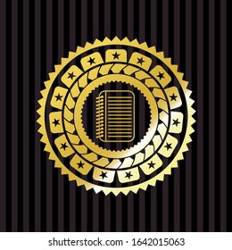 note book icon inside gold emblem or badge