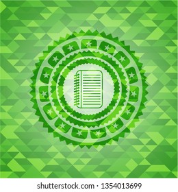 note book icon inside green emblem. Mosaic background