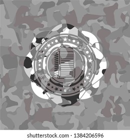 note book icon inside grey camo emblem