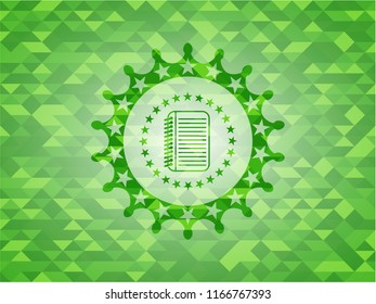 note book icon inside realistic green mosaic emblem
