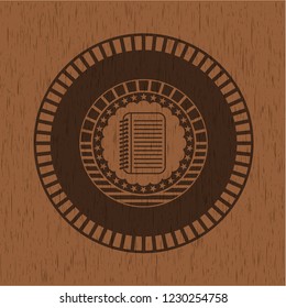 note book icon inside realistic wooden emblem