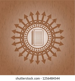 note book icon inside realistic wooden emblem