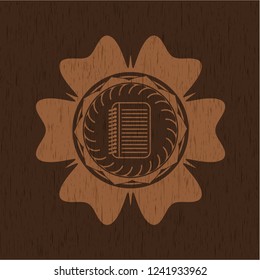 note book icon inside retro style wooden emblem