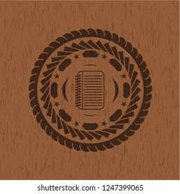 note book icon inside retro wood emblem