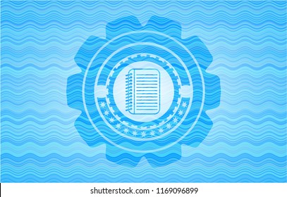 note book icon inside water representation style emblem.