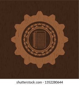 note book icon inside wood emblem