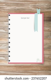 Note book on a wooden desk. Vector illustration.
