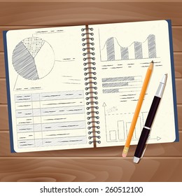 Note pad with diagrams and charts in skechi style with pen and pencil on wooden background.