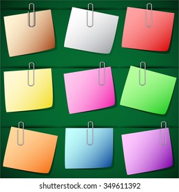 Note Paper pinched by paperclip on the board.