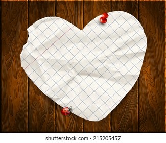 Note papers with a paper heart on a wooden background 