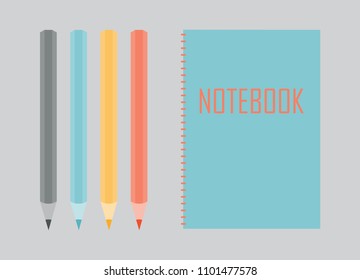 Notebook with colorful pencils
