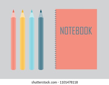 Notebook with colorful pencils