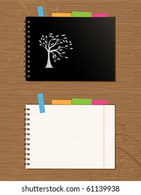 Notebook cover and page design on wooden background