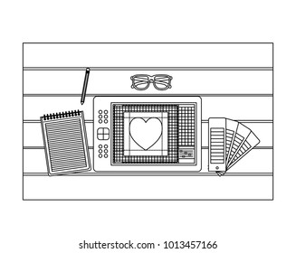 notebook and design tools and tablet digitizer over table on top view in black contour