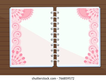 Notebook with floral design on the table
