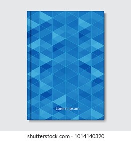 Notebook, geometric shapes  composition on blue background.