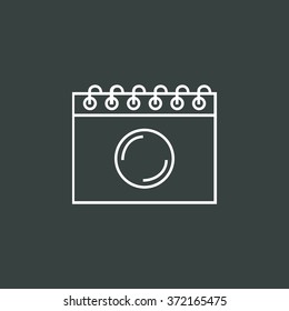 notebook icon, on dark background, white outline, large size symbol