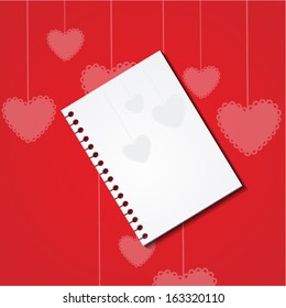 notebook on the background of hearts
