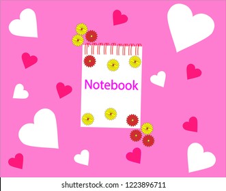 Notebook on a pink background