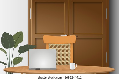 notebook on the wooden table and wooden chair in the house