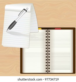 notebook with pen and diary on the table