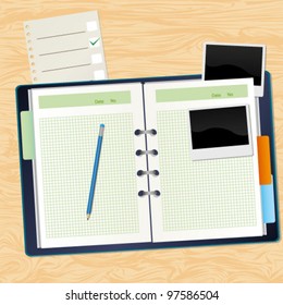 Notebook pencil blank photos on the table