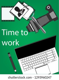 Notebook, pencil, camera on a green background
