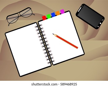 notebook, pencil,  glasses and phone on wooden desk