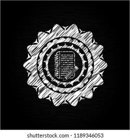 notebook with pencil icon drawn on blackboard