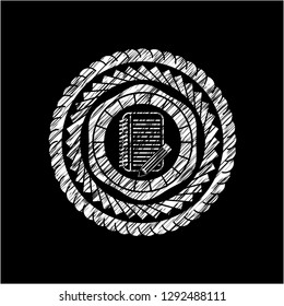 notebook with pencil icon inside chalkboard emblem written on a blackboard