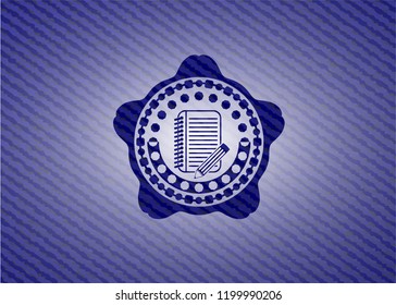 notebook with pencil icon inside denim background