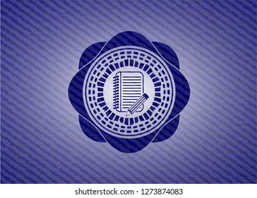 notebook with pencil icon inside emblem with denim texture