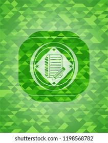notebook with pencil icon inside green emblem with triangle mosaic background