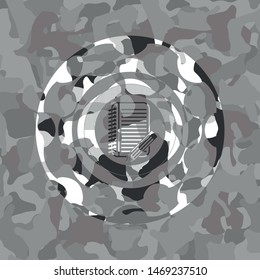 notebook with pencil icon inside grey camouflage texture