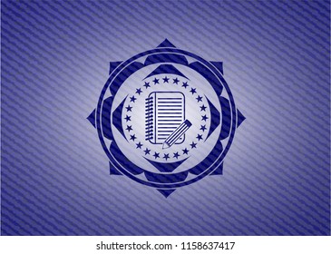 notebook with pencil icon inside jean background