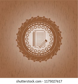 notebook with pencil icon inside retro wooden emblem