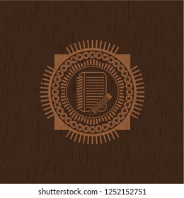 notebook with pencil icon inside retro wooden emblem
