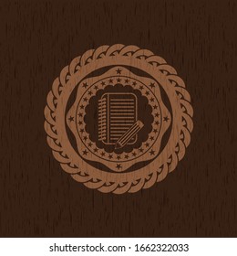 notebook with pencil icon inside retro wood emblem