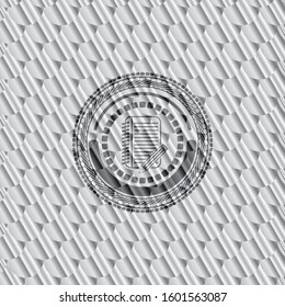 notebook with pencil icon inside silver color badge or emblem. Scales pattern. Vector Illustration. Detailed.