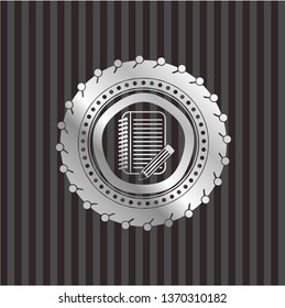 notebook with pencil icon inside silvery shiny badge