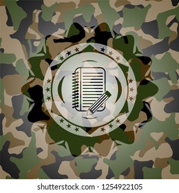 notebook with pencil icon on camo pattern