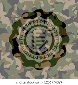 notebook with pencil icon on camo pattern