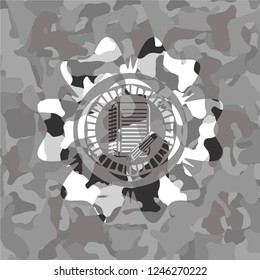 notebook with pencil icon on grey camo texture