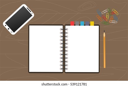 notebook, pencil and phone on desk