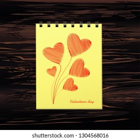 Notebook with template hand-drawn bouquet of red hearts . Vector on wooden background. Greeting card on holiday. Valentines day. A realistic notepad. Office stationery. For notes