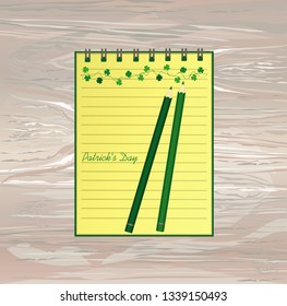 Notebook with template hand-drawn Green festive bunting with clover and pencil. Irish holiday - Happy St. Patrick's Day with a garland of three-leaf. Vector on wooden background